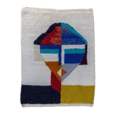 Jovial Moroccan Rug, a blue, red, and tangerine on natural white wool, showcasing the eclectic style of Berber women