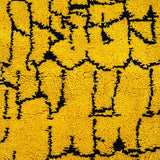 Taliouine Moroccan Rug, saffron yellow with black patterns in 100% wool, inspired by the vibrant culture of southern Morocco