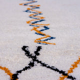 original Berber carpet with intricate abstract symbols, adding an artistic, boho touch to any space