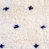 Blue Dalmatian rug, creamy white with indigo blue dots, adding natural charm and coziness to any decor. A stunning Beni Ourain piece