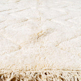 Sand Storm Moroccan Rug, crafted from 100% wool, featuring intricate white patterns for authentic comfort and timeless style
