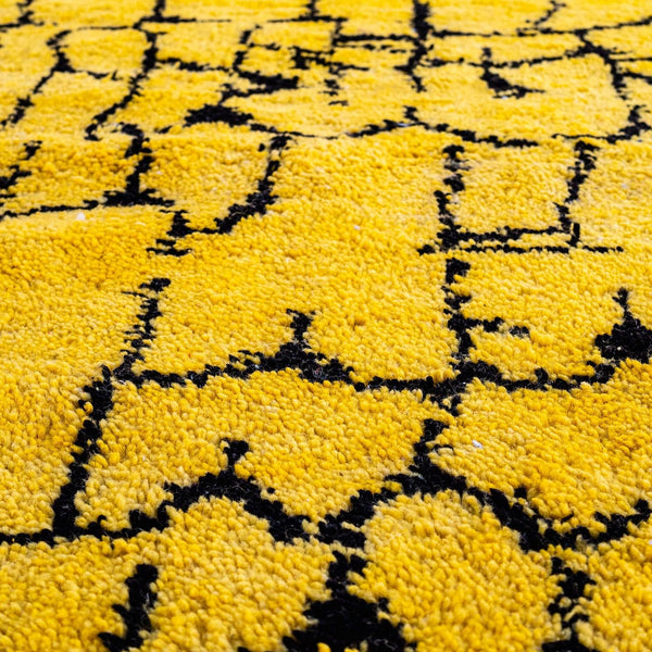 Taliouine Moroccan Rug, saffron yellow with black patterns in 100% wool, inspired by the vibrant culture of southern Morocco